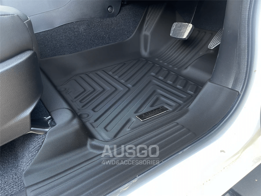 Close-up of a black 5D car floor mat by Ausgo, featuring a textured surface and raised edges for maximum protection against dirt, spills, and debris