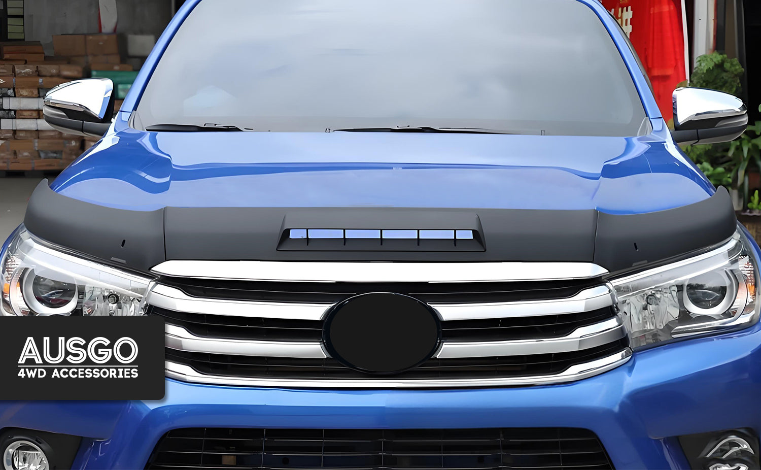 A front view of a blue Toyota HiLux.