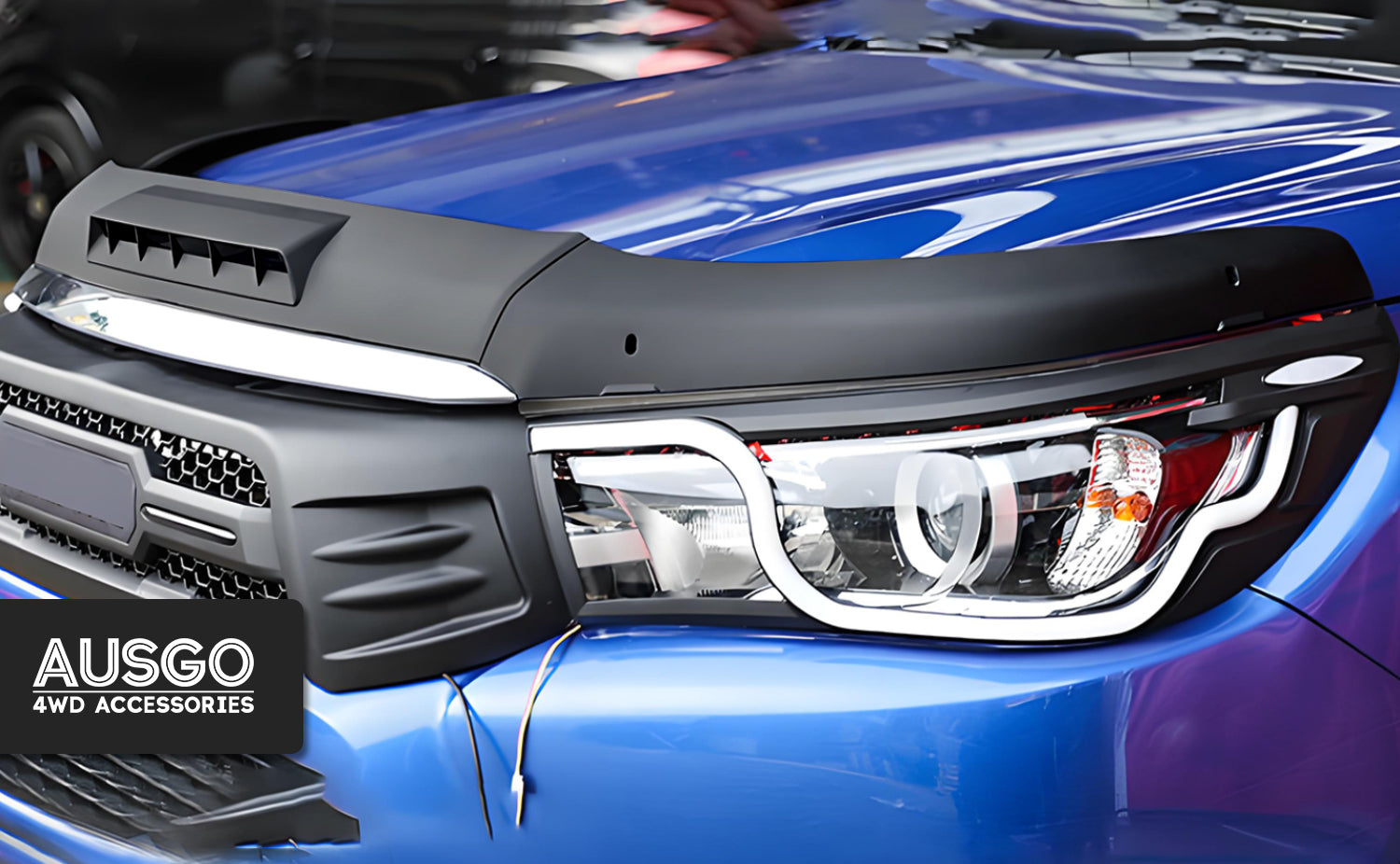 Side view of a blue Toyota Hilux