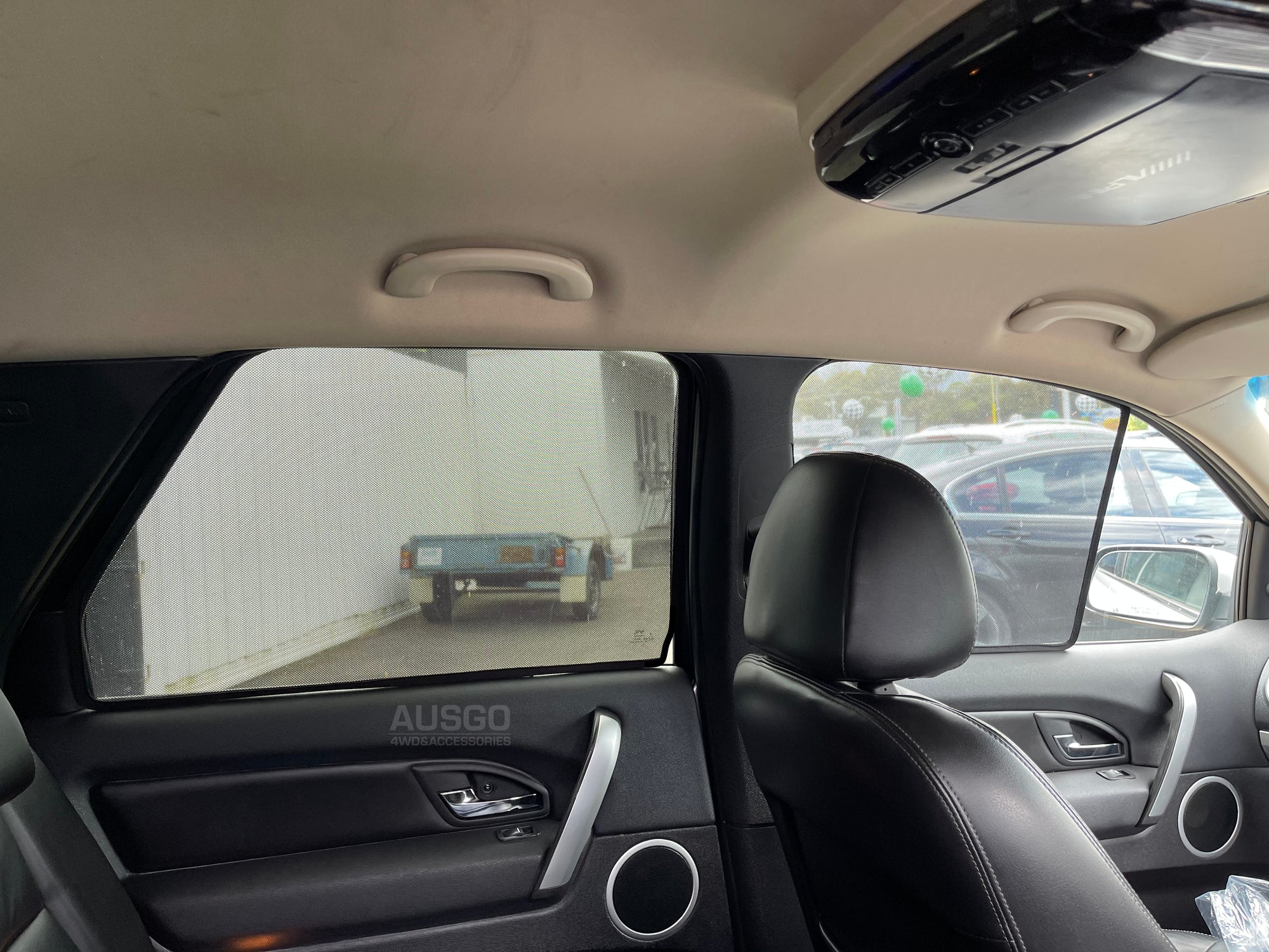 Interior view of a car with sun shades installed on the windows