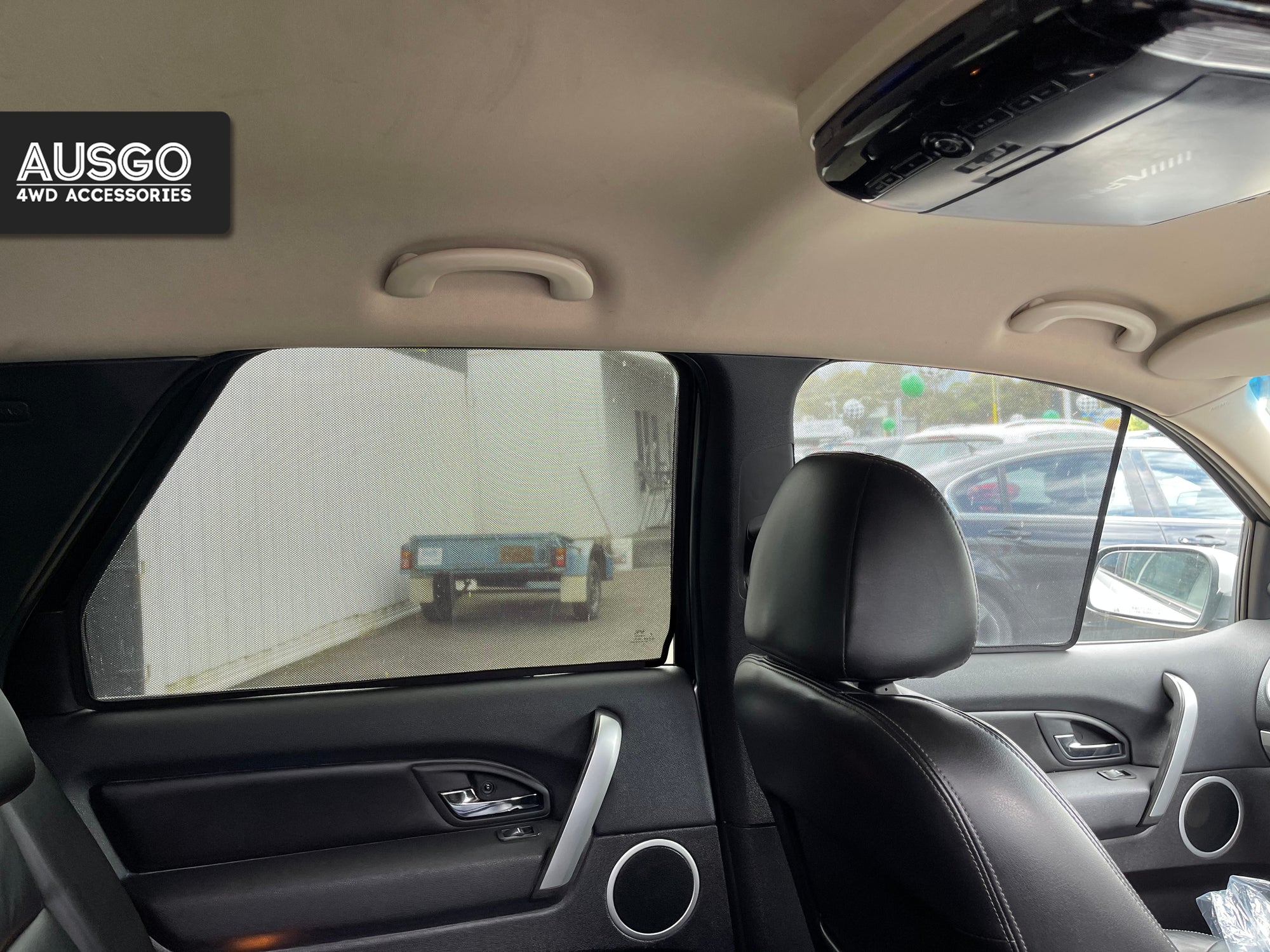 Interior view of a Ford Territory with sun shades attached to the window.