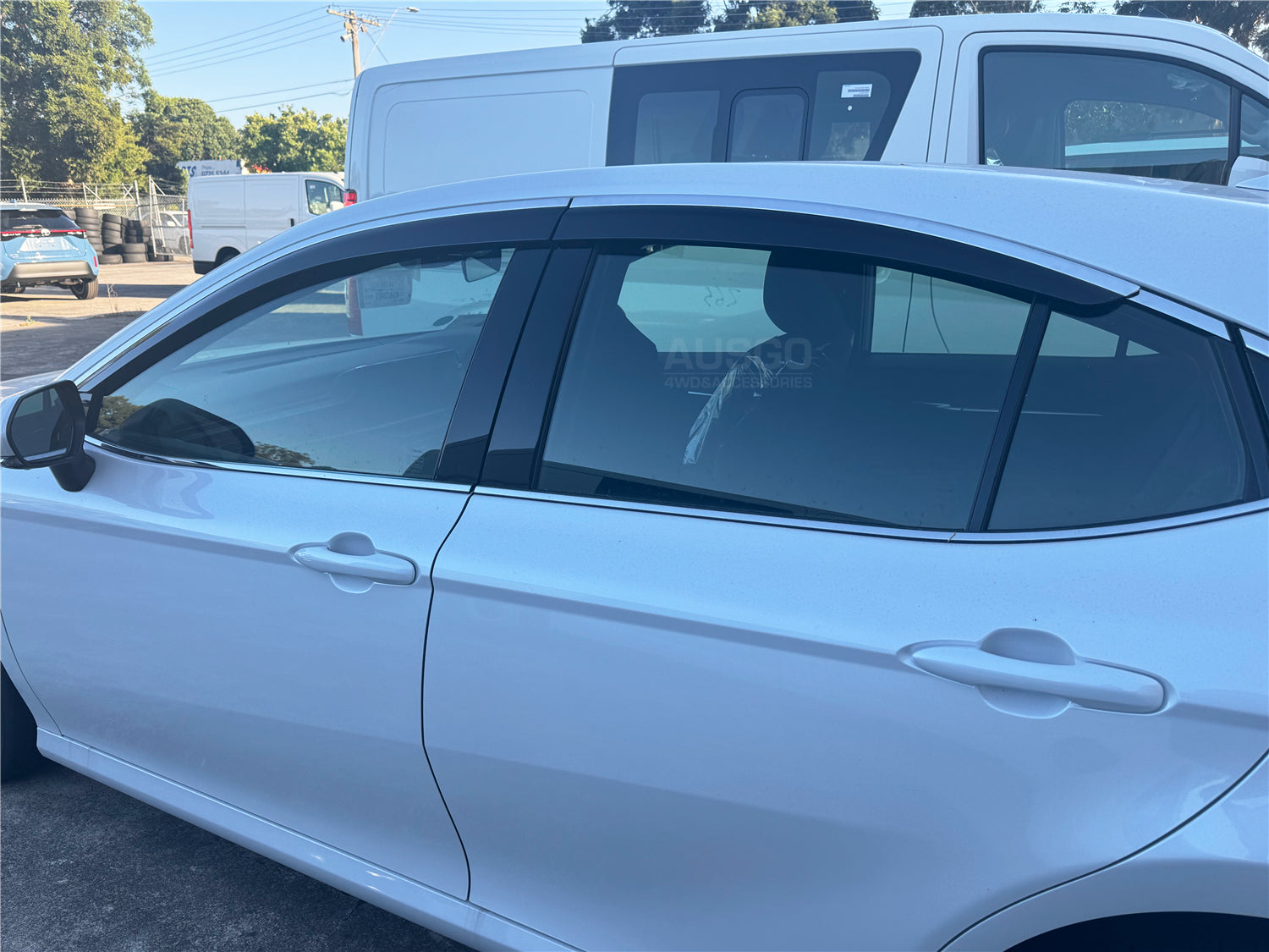 A side view of Toyota Camry parked in an outdoor carpark.