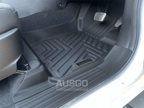 Close-up of a black 5D car floor mat by Ausgo, featuring a textured surface and raised edges for maximum protection against dirt, spills, and debris