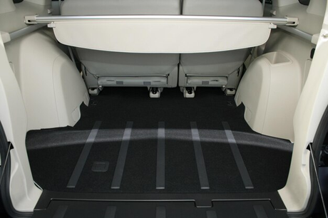 Clean car boot interior showcasing a carpeted cargo area, ideal for comparing the benefits of adding custom-fit boot liners for car interior protection.