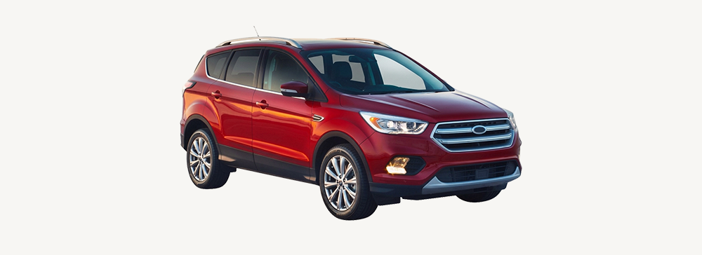 Side view of a red Ford Escape parked in an outdoor area. 